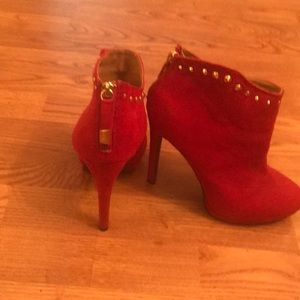 Red booties with gold accents